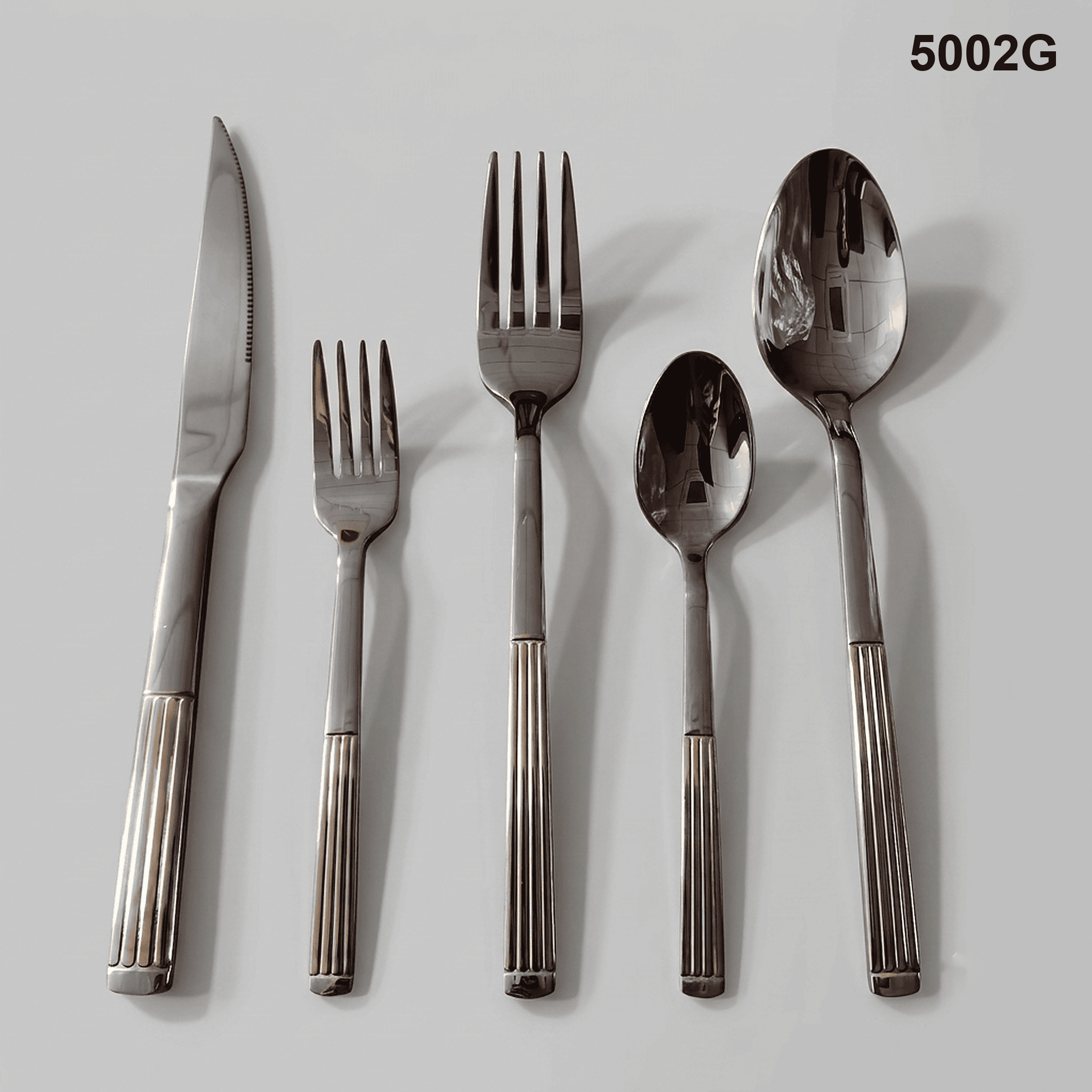 5002G vertical fluted lower handles with a rounded terminal detail and polished utensil heads 20-piece flatware set