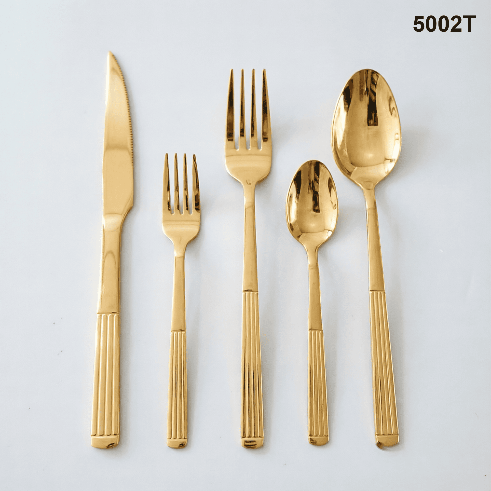 5002T vertical fluted lower handles with a rounded terminal detail and polished utensil heads 20-piece flatware set
