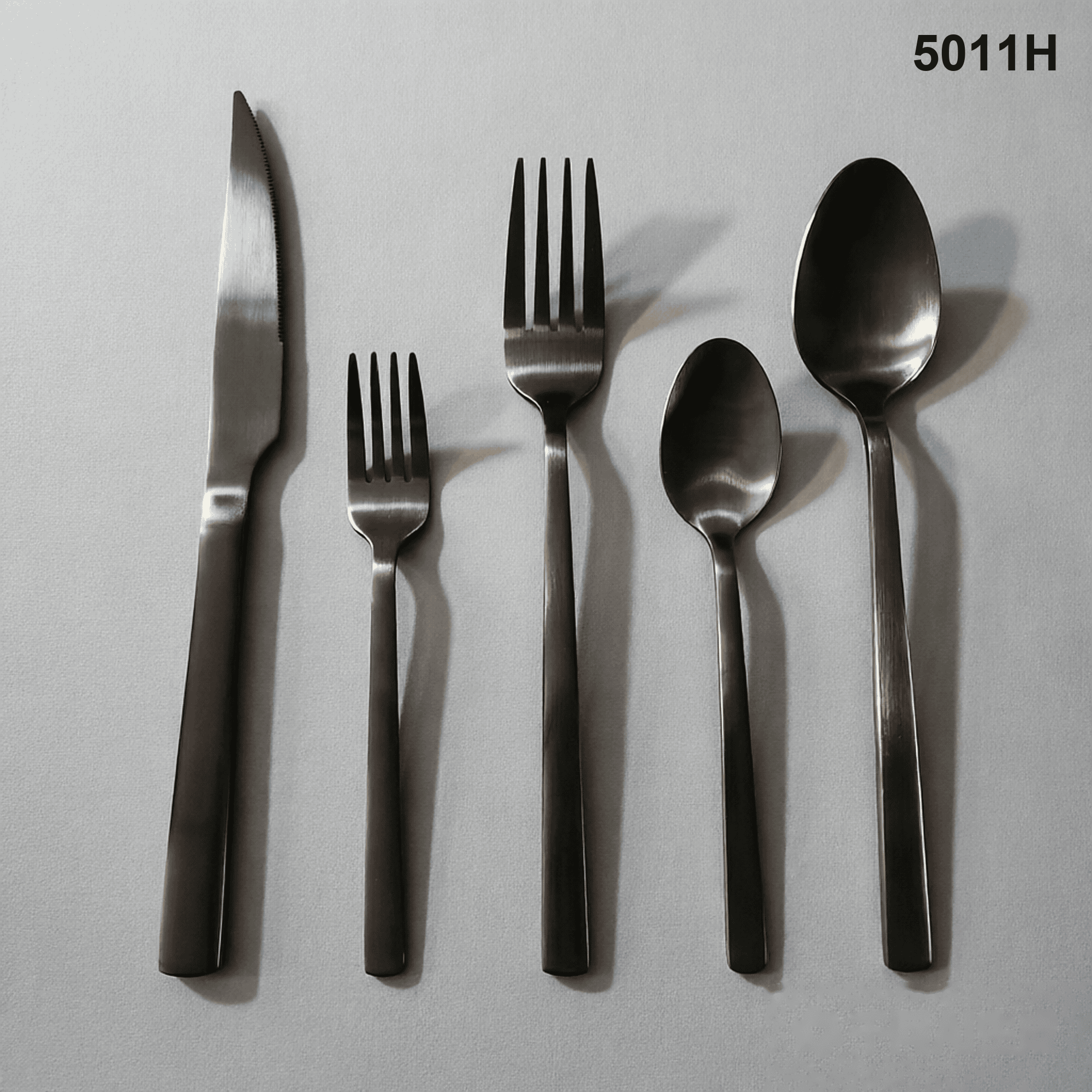 5011H clean straight-to-tapered handles with rounded ends and a restrained satin appearance 20-piece flatware set