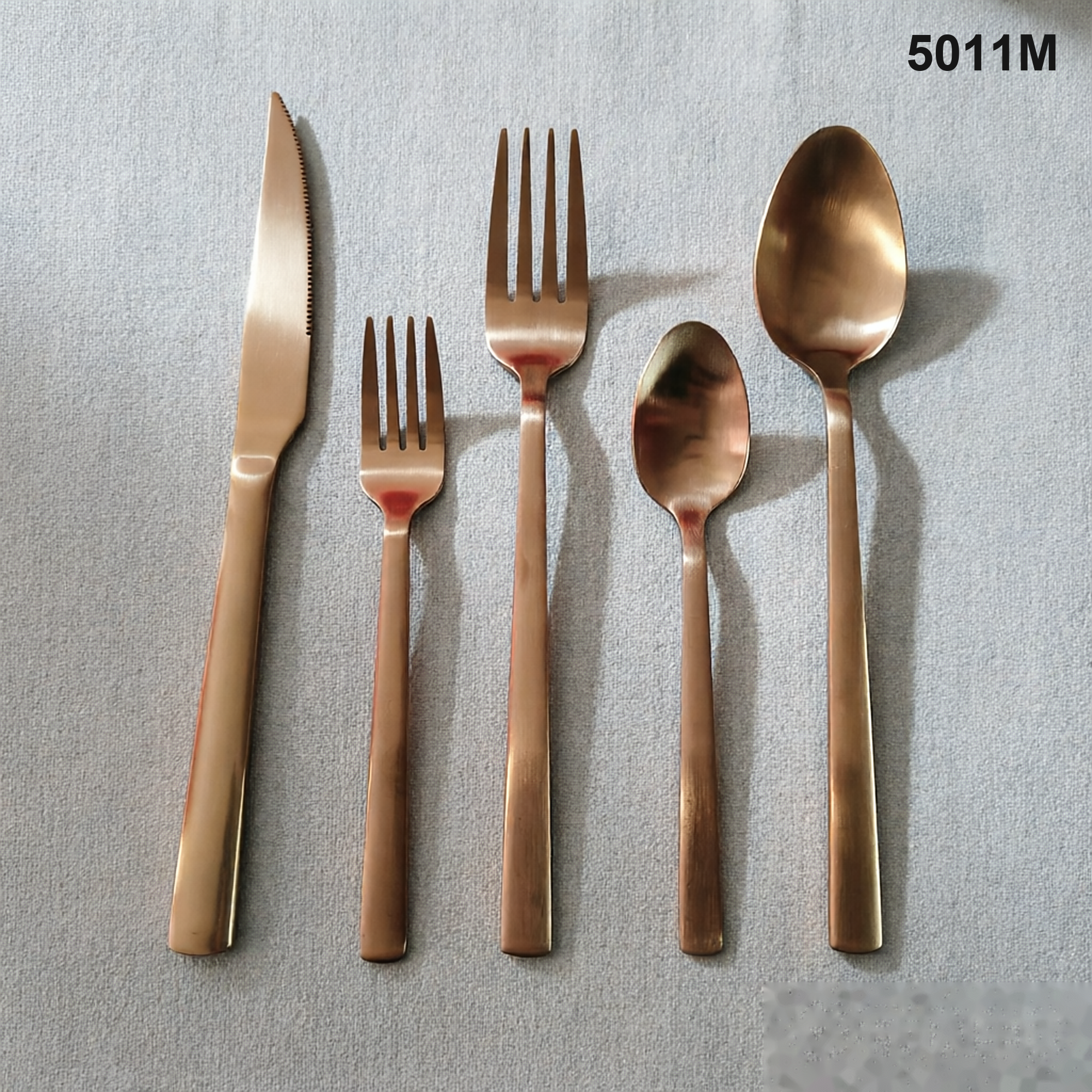 5011M clean straight-to-tapered handles with rounded ends and a restrained satin appearance 20-piece flatware set
