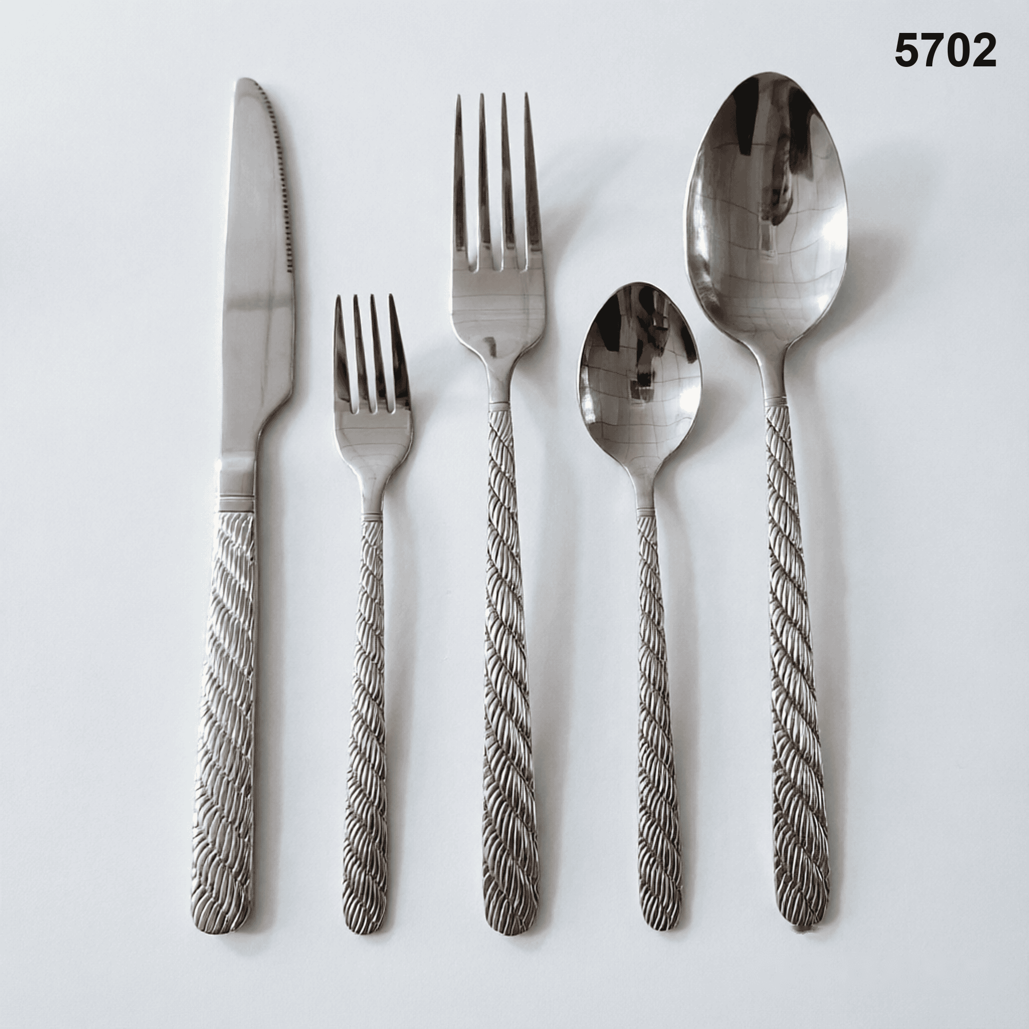 5702 repeating diagonal braided or rope-like texture running down the handles 20-piece flatware set
