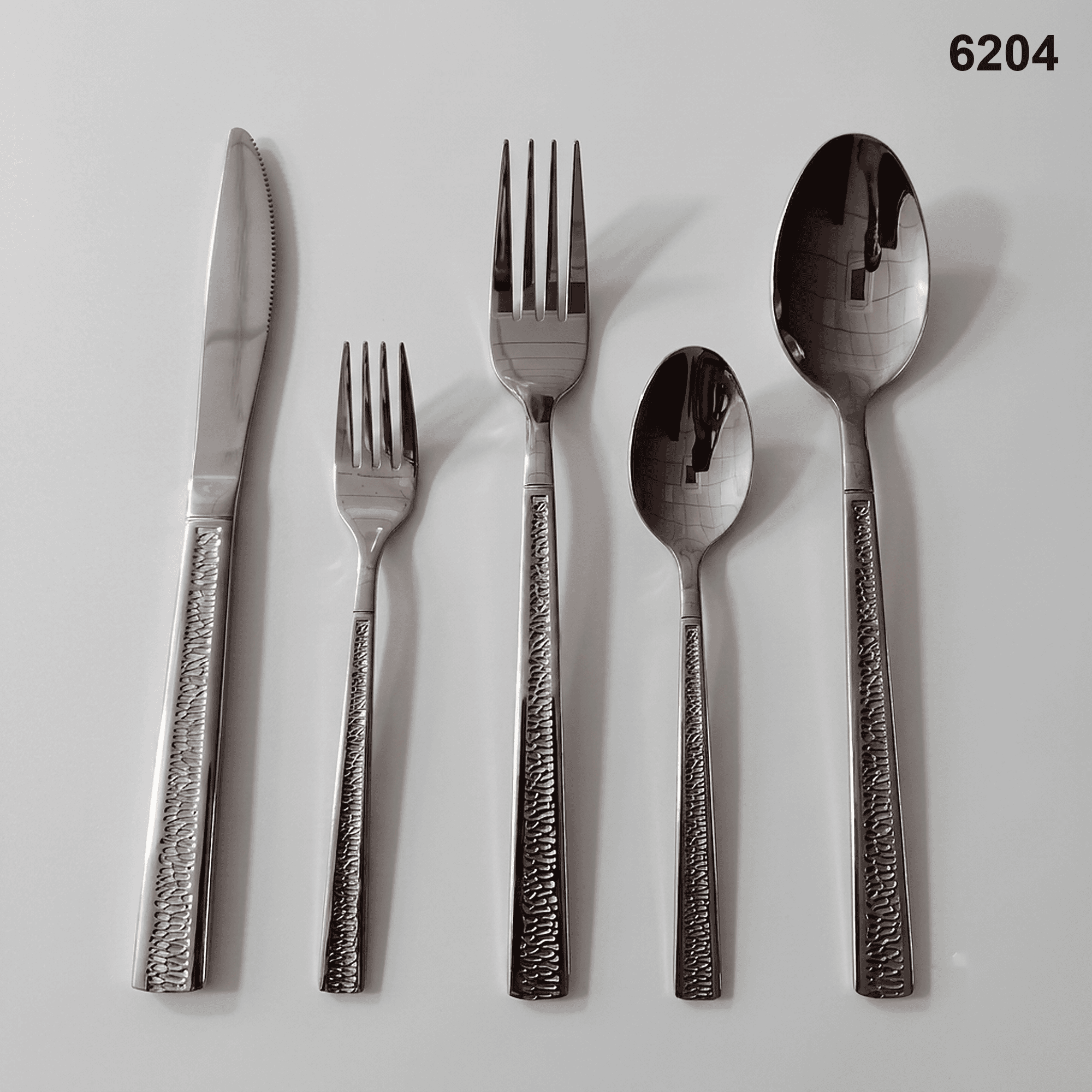 6204 a narrow recessed central texture strip bordered by smooth straight handle edges 20-piece flatware set