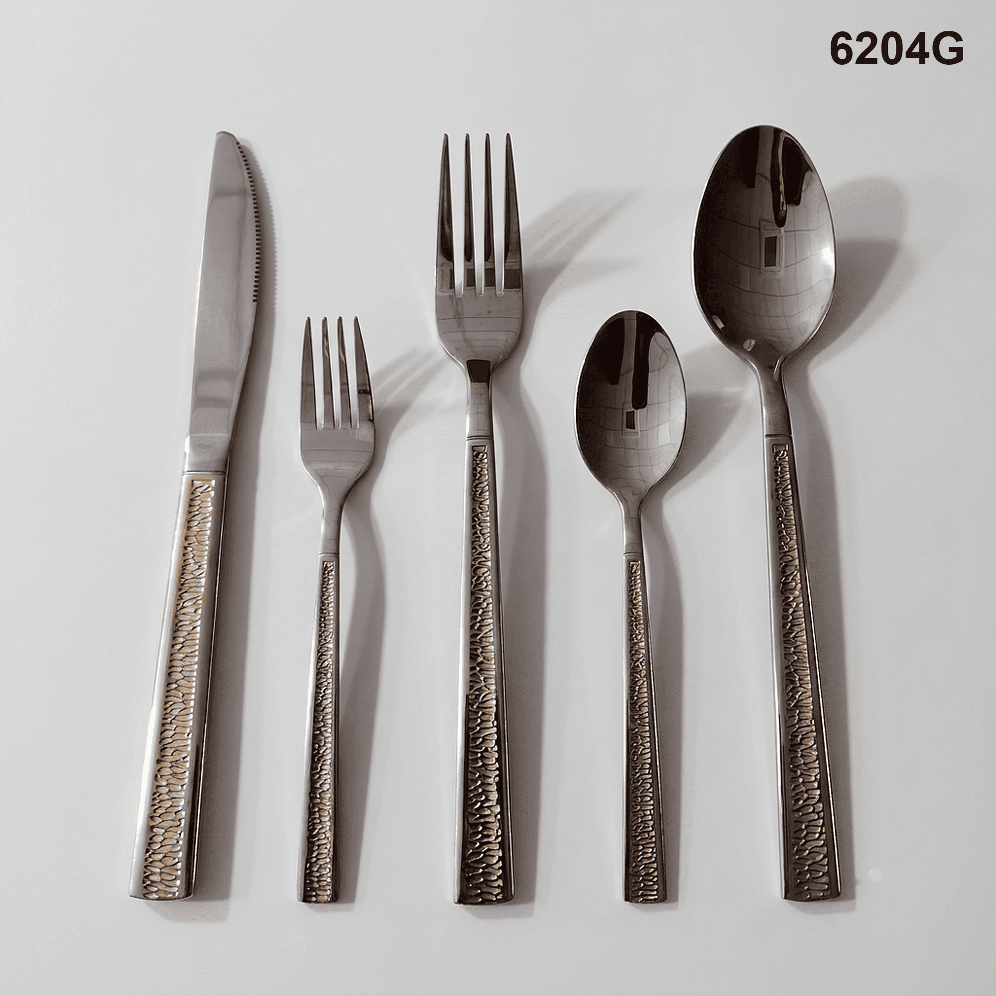 6204G a narrow recessed central texture strip bordered by smooth straight handle edges 20-piece flatware set